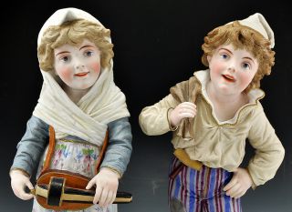 2 Antique Bisque Porcelain Tall Figurines Boy Girl Hurdy Gurdy 18"