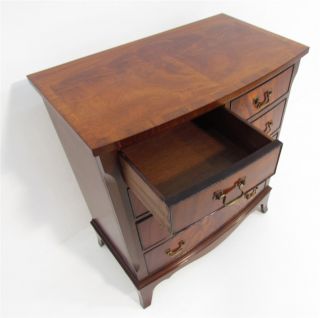 A Small Flamed Mahogany Bow fronted Chest of Drawers
